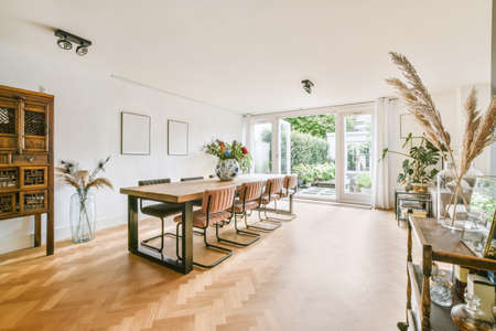 Spacious dining area for eight with comfortable and modern chairs and table