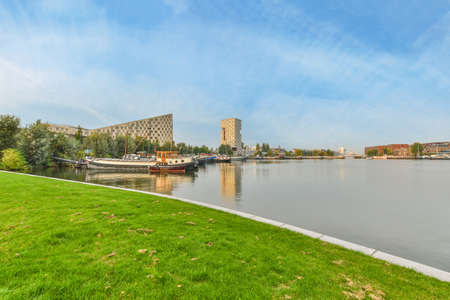 Amazing view of the river surrounded by greeneryの写真素材