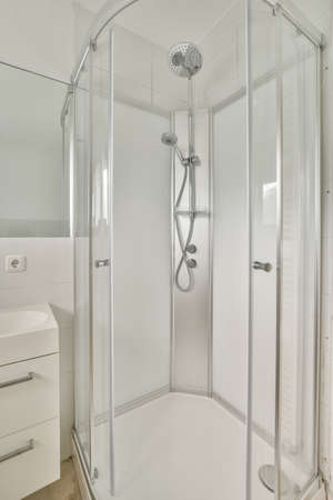 Modern shower stall in a bright bathroom