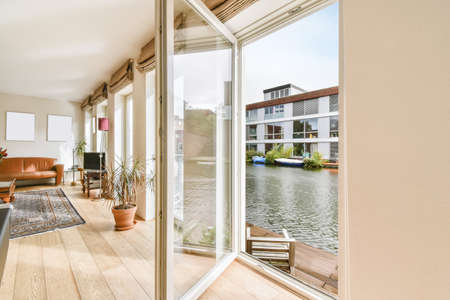 Lovely living room with an open door overlooking the boathouse