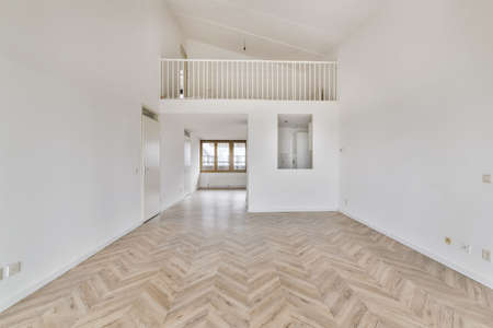 Luxurious room with a second floor upstairs with a railing