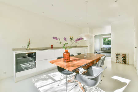 Bright dining room combined with a modern kitchen