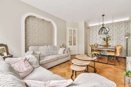 Amazing living room with gray sofas and round coffee table