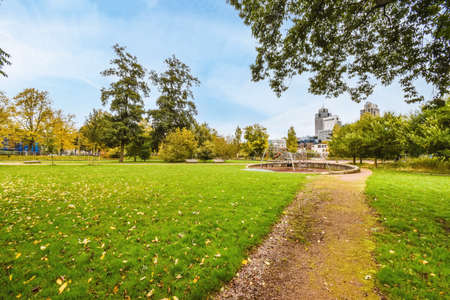 Superb green park with paths and green meadowの写真素材