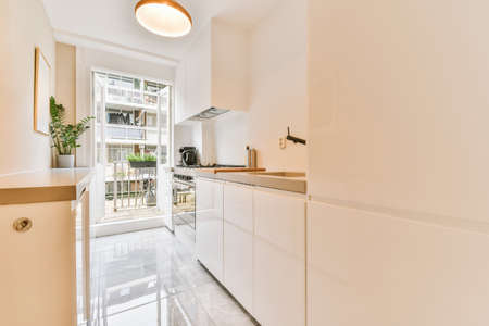 Modern minimalist kitchen with glossy kitchen set