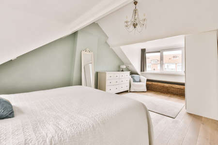Lovely bedroom with an elegant bed and a window on the wall