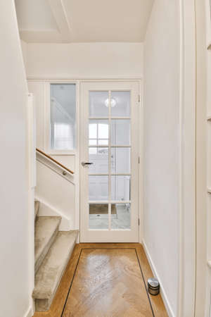 Lovely corridor with wooden glass door and staircase
