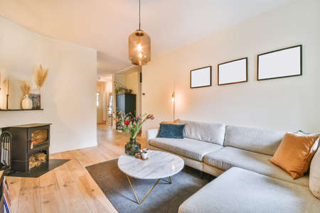 Cozy living room with beige sofa and bright multi-colored pillows