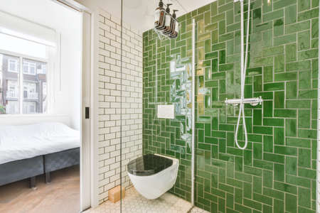 Bathroom with green and white patterned tiles