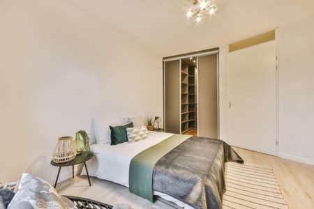 Interior of a cozy and bright bedroom with beautiful decoration