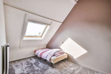 single room with bed, computer and work area