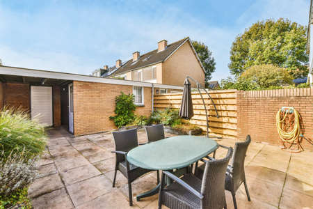Backyard with greenery and amenities in the form of a recreation area
