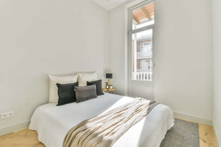 Interior of a cozy and bright bedroom with beautiful decoration