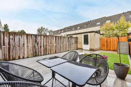 nice courtyard with greenery and a comfortable seating areaの写真素材