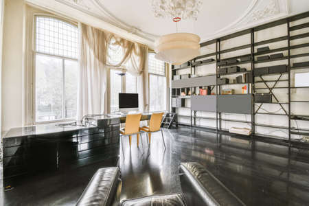 Amazing work room with black floor and black leather chairの写真素材