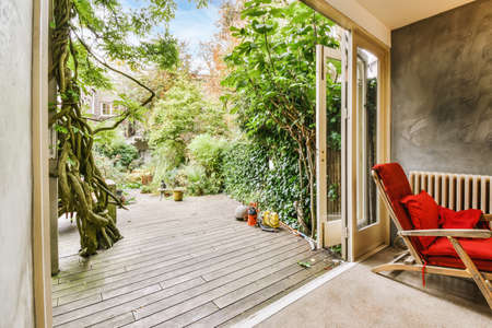 Delightful home courtyard with green trees and plantsの写真素材