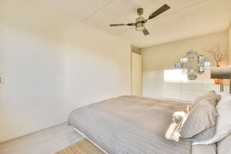 Interior of a cozy and bright bedroom with beautiful decoration