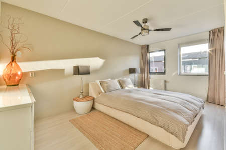 Interior of a cozy and bright bedroom with beautiful decoration