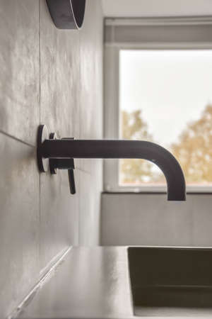 Close up of luxury faucet in an elegant bathroom