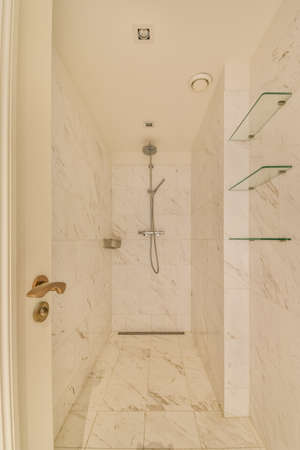 Modern shower stall in a bright bathroom