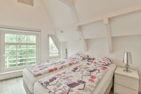 Interior of a cozy and bright bedroom with beautiful decoration