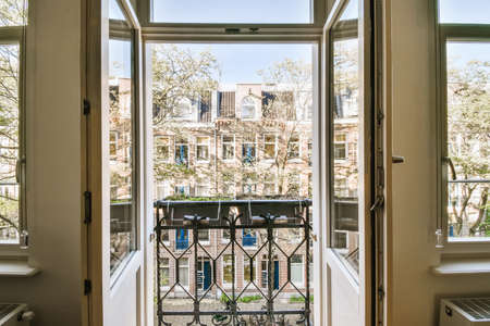 Open doors leading to the balcony of a luxurious room