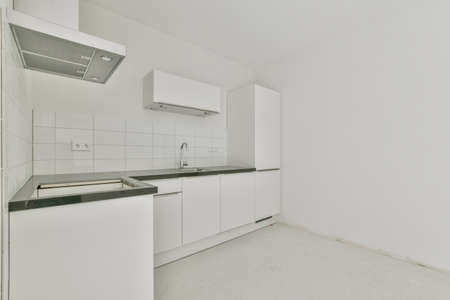 Cozy kitchen zone with in a spacious apartmentの写真素材