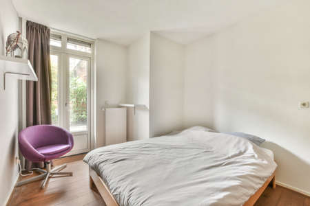 Interior of a cozy and bright bedroom with beautiful decoration