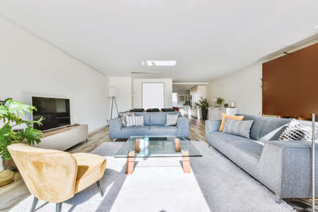 Stunning living room in daylight with wooden floorの写真素材