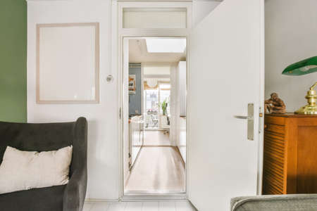A delightful hallway with an open door in daylight