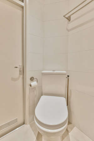 Lovely restroom with a shelf and a small miniature sink