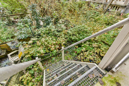 the stairs access to the garden outside the house