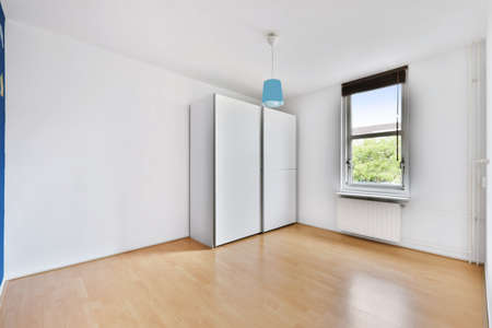 Spacious bright and pretty room with large windowsの写真素材