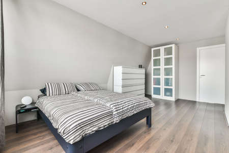 Beautiful bedroom in new luxury home with some decor