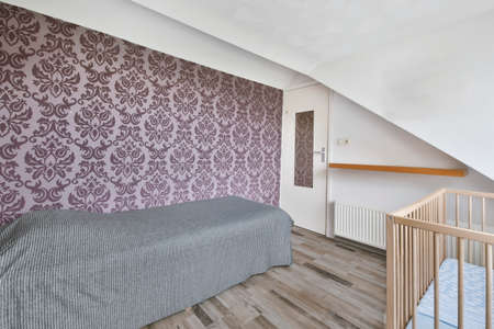 Stunning bedroom with a gray bedspread over the bed