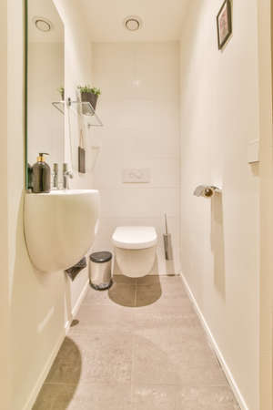 Interior of small clean restroom in miniature styleの写真素材