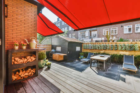 Comfortable courtyard of the house with an orange canopy