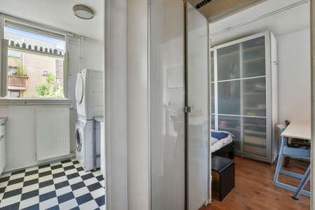 Interior of small clean laundry room in modern hauseの写真素材