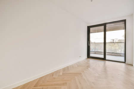 Luxurious empty room with door and parquet floorの写真素材