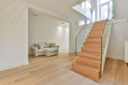 the wooden staircase accessing to the down floors hall