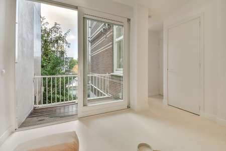 interior of a balcony with sliding glass doorsの写真素材