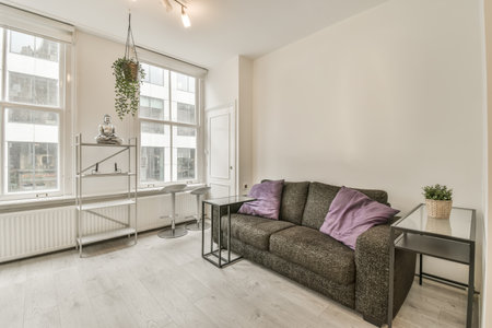 small but cozy living room with large windows