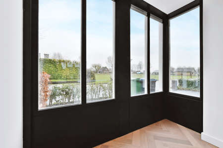 Modern design of the room with a black door facing the courtyard