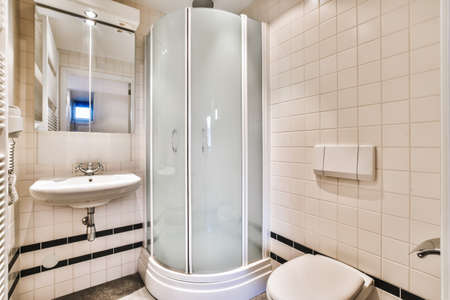 The interior of a comfortable bathroom with a shower cabin