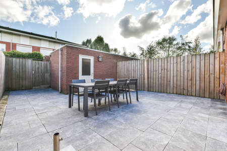 Large backyard with no trees or plants,Outdoor dining area
