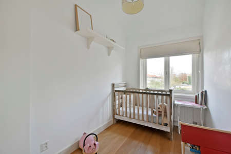 Small childrens room for toddlers with a small bedの写真素材