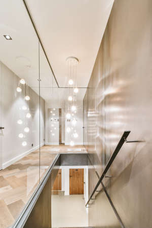 Attractive staircase in dark colors with comfortable handrails