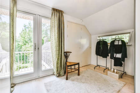 The interior of a beautiful room with a door to the balcony and a rug