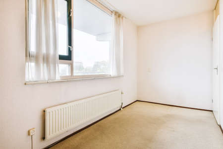 A lovely room with light walls in daylight