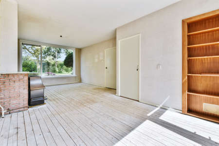 Delightful room with wooden floor and fireplace